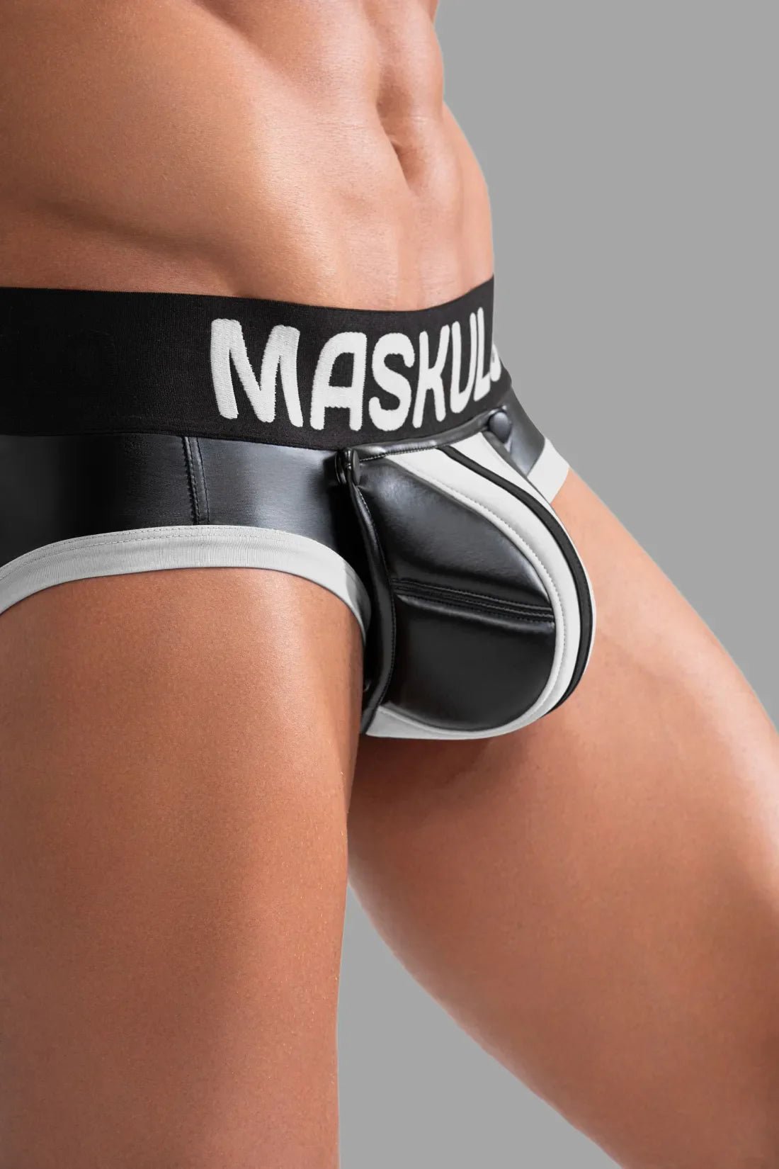 Maskulo Black and White Briefs with Pads. Polyester/polyurethane/elastane blend underwear featuring massive PU leather back pads.