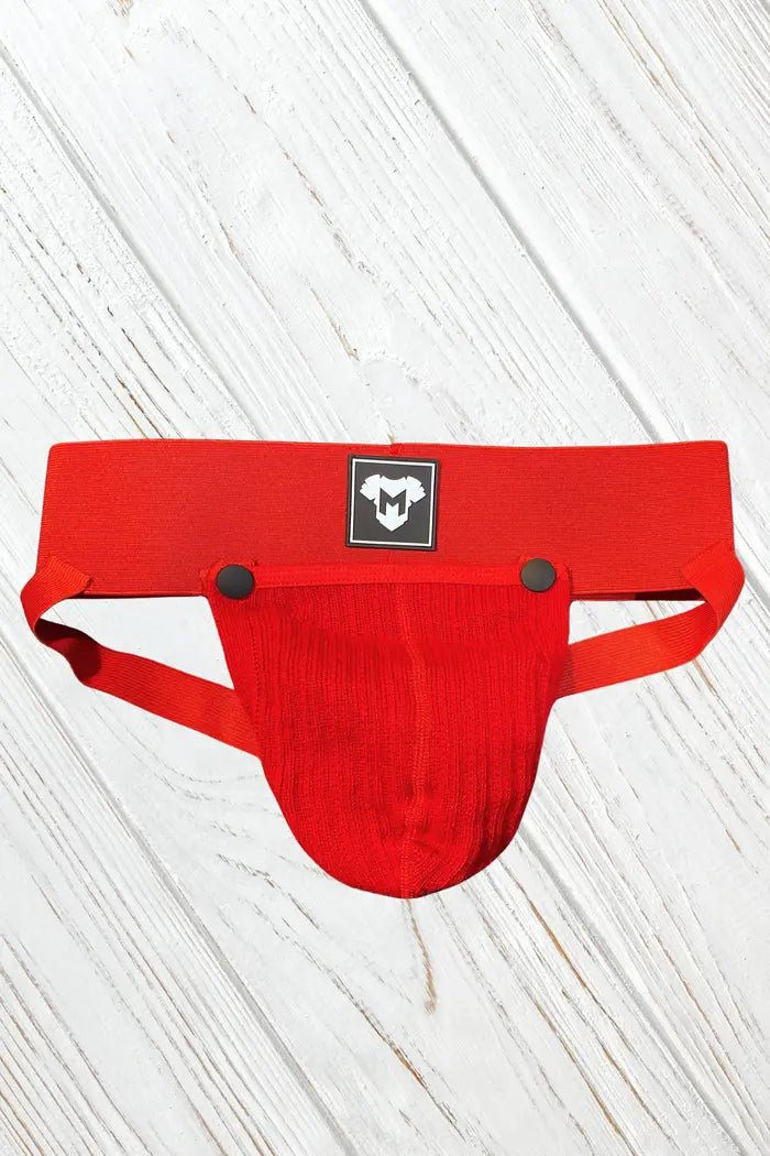 Red Dash Cyclone jockstrap by Maskulo with a removable mesh pouch and wide 7.5 cm waistband. Rough design, made from polyester, cotton, and spandex.