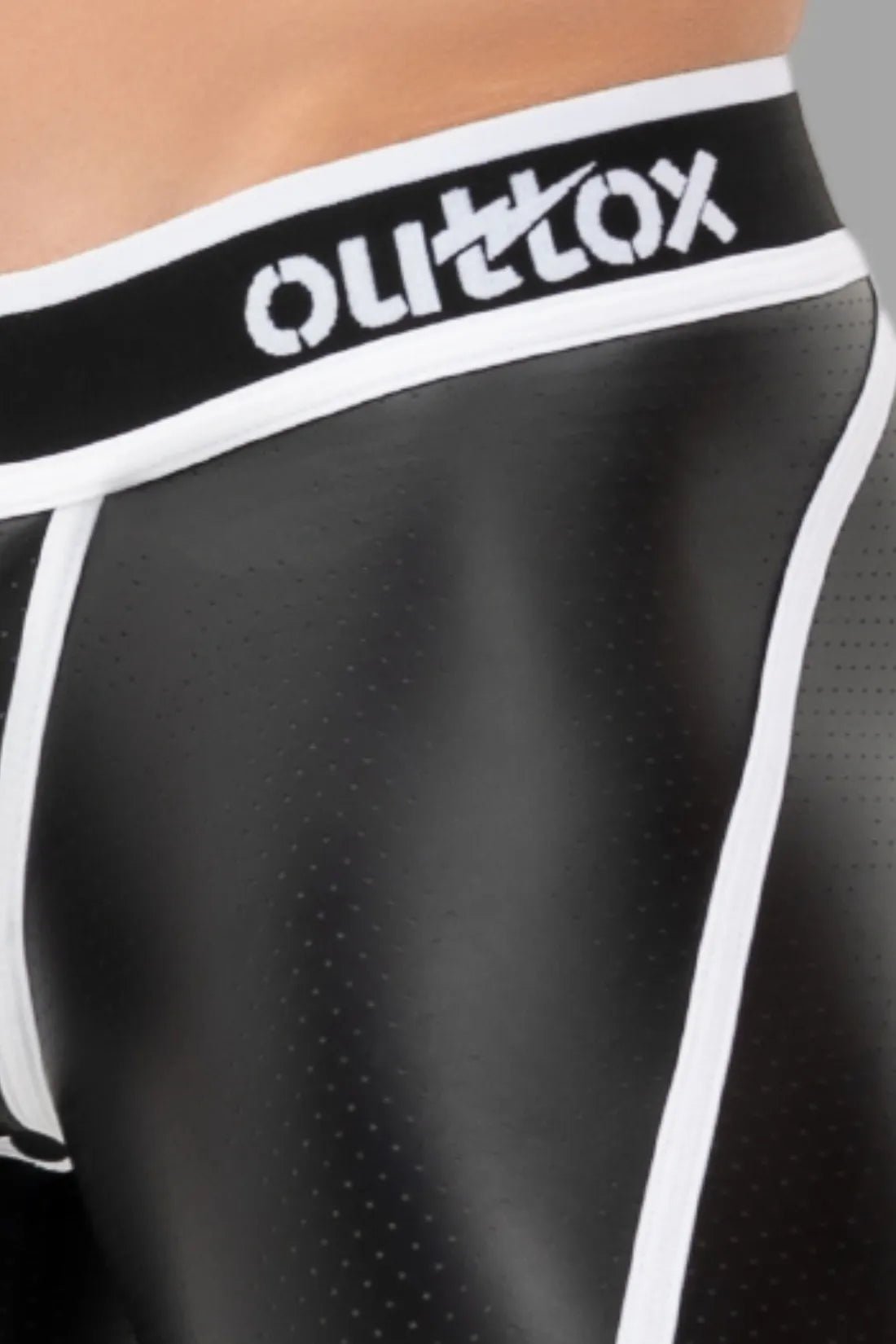 Outtox Open Rear Shorts in black and white with snap codpiece. Features perforated PU eco leather material and open rear design.