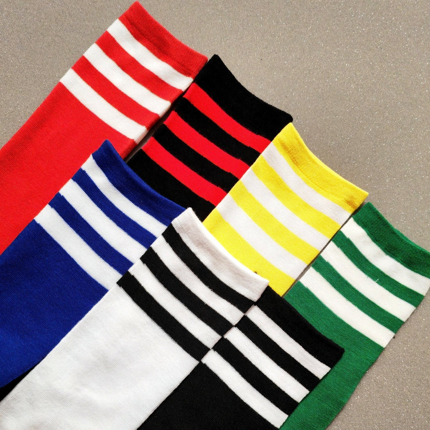 Maskulo Long Socks: White with Black Stripes. Polyester and cotton blend, stretchy, 45cm total length. Ideal for football and running.