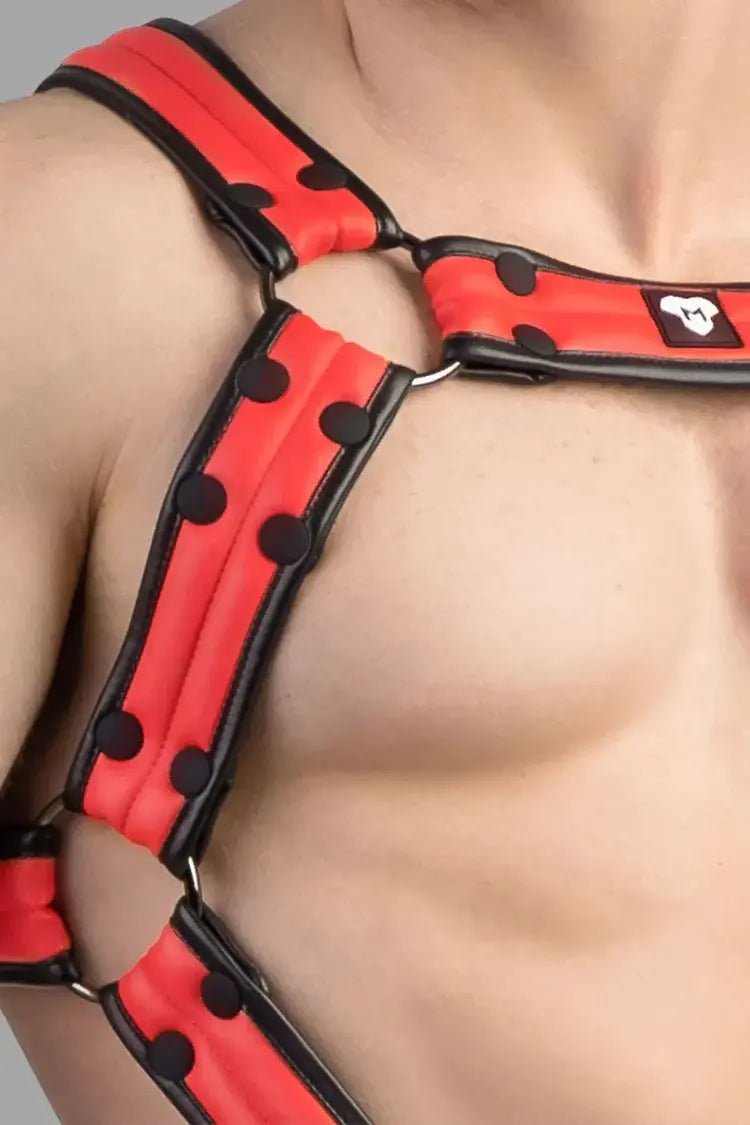 Maskulo Armored Next Body Harness in black and red, featuring a durable polyester/polyurethane blend, bulldog style with removable cockring.