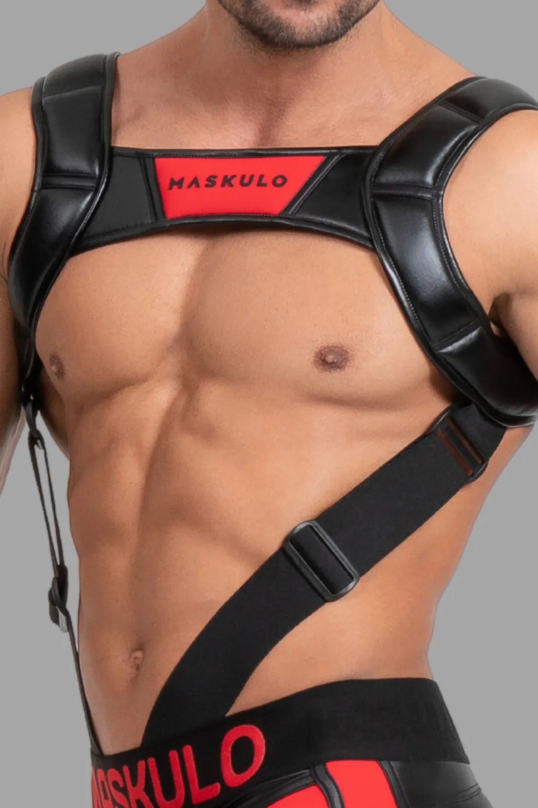 Maskulo Body Harness in Black and Red with push-up effect. Adjustable polyester/polyurethane blend for a perfect, striking look.