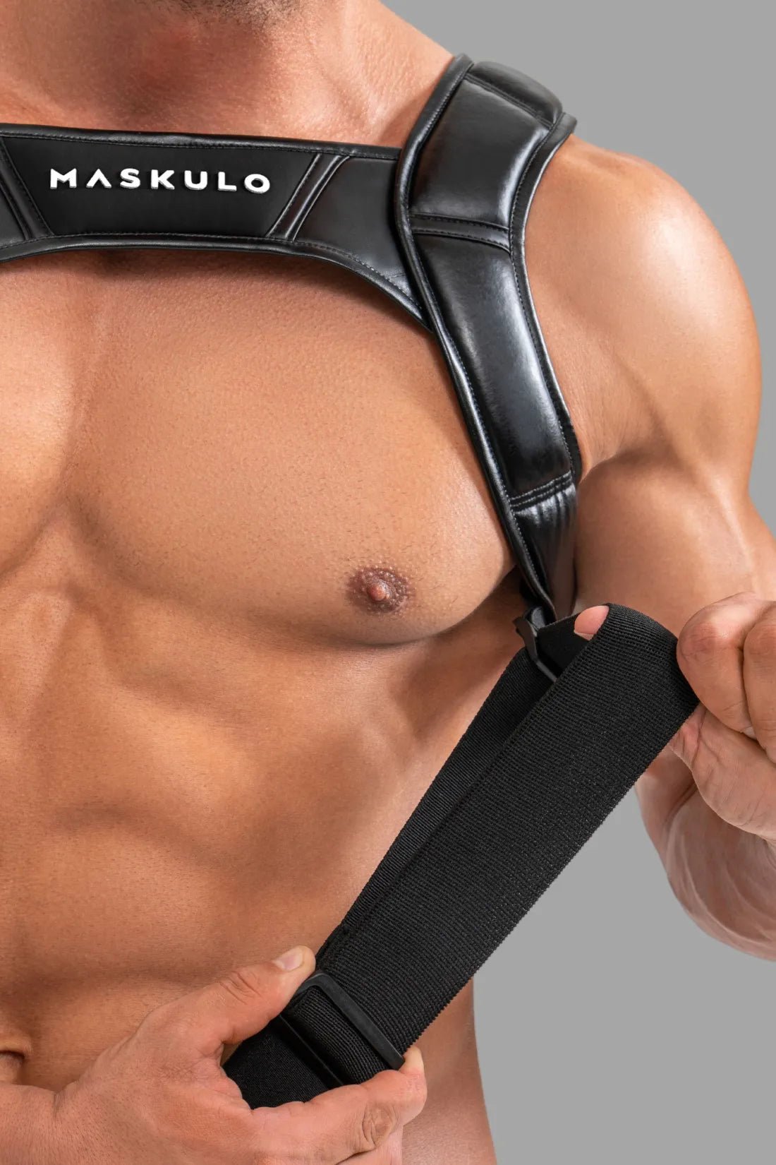 Maskulo Black Body Harness with Push-up Effect, polyurethane/polyester blend, adjustable, featuring a cockring and 3D branding.