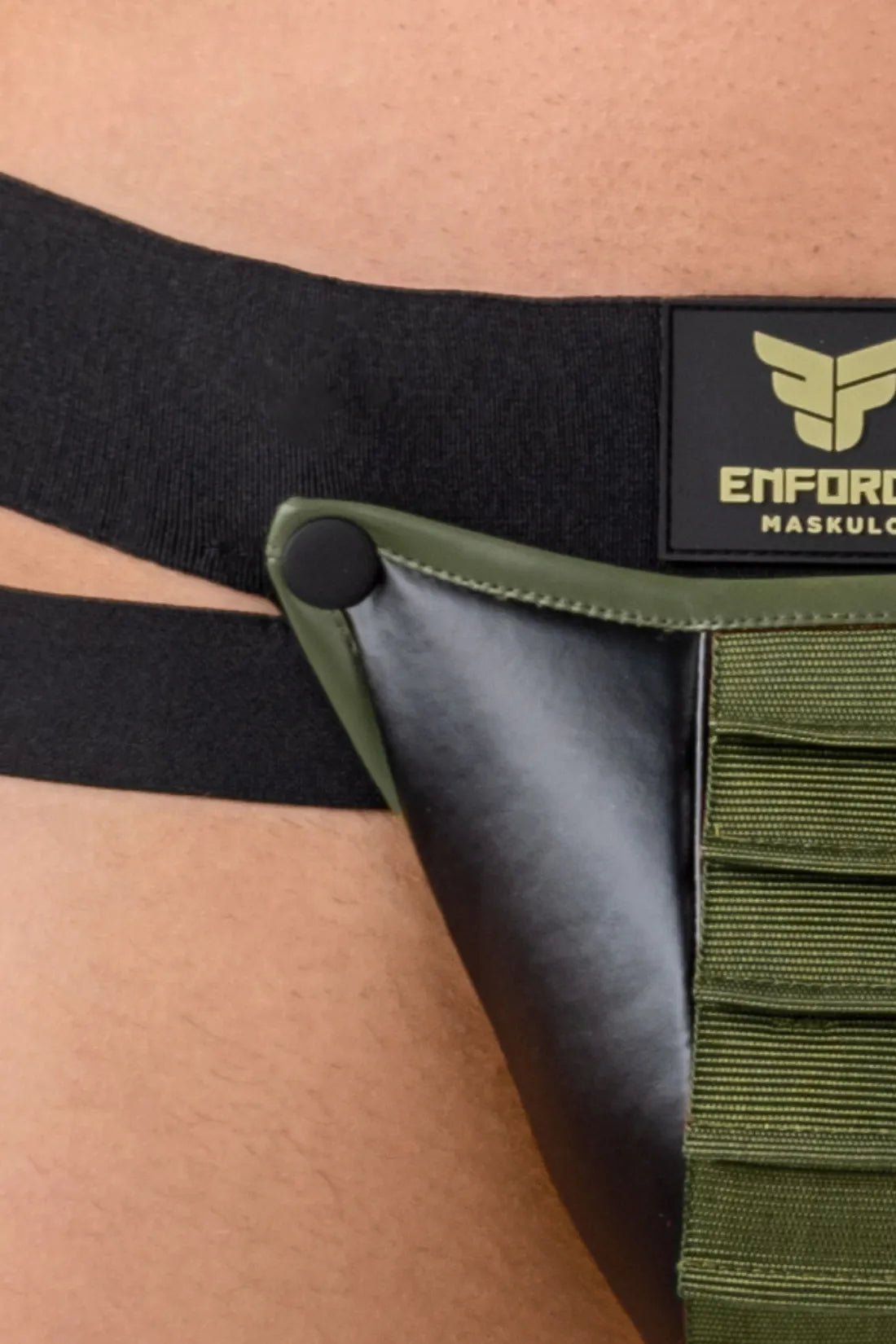 Maskulo Eagle Enforce Pouch Jockstrap in black and green, featuring a detachable corrugated pouch, enforce logo waistband, polyester/polyurethane.