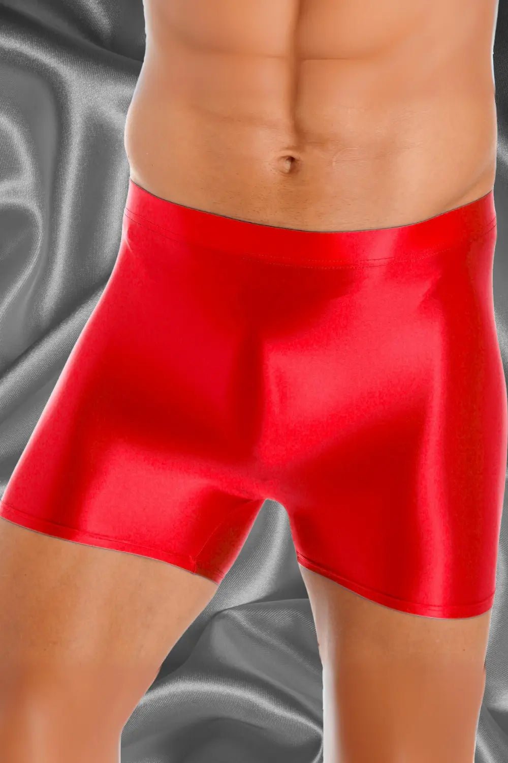 Pierce Ironsilk tight silky red mid-thigh shorts by Maskulo, featuring a wet look gloss, stretchy, and incredibly smooth material.