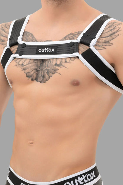 Outtox Bulldog Harness in black and white with snaps. Fetish look, PU leather-covered straps, polyester-polyurethane-elastane blend.