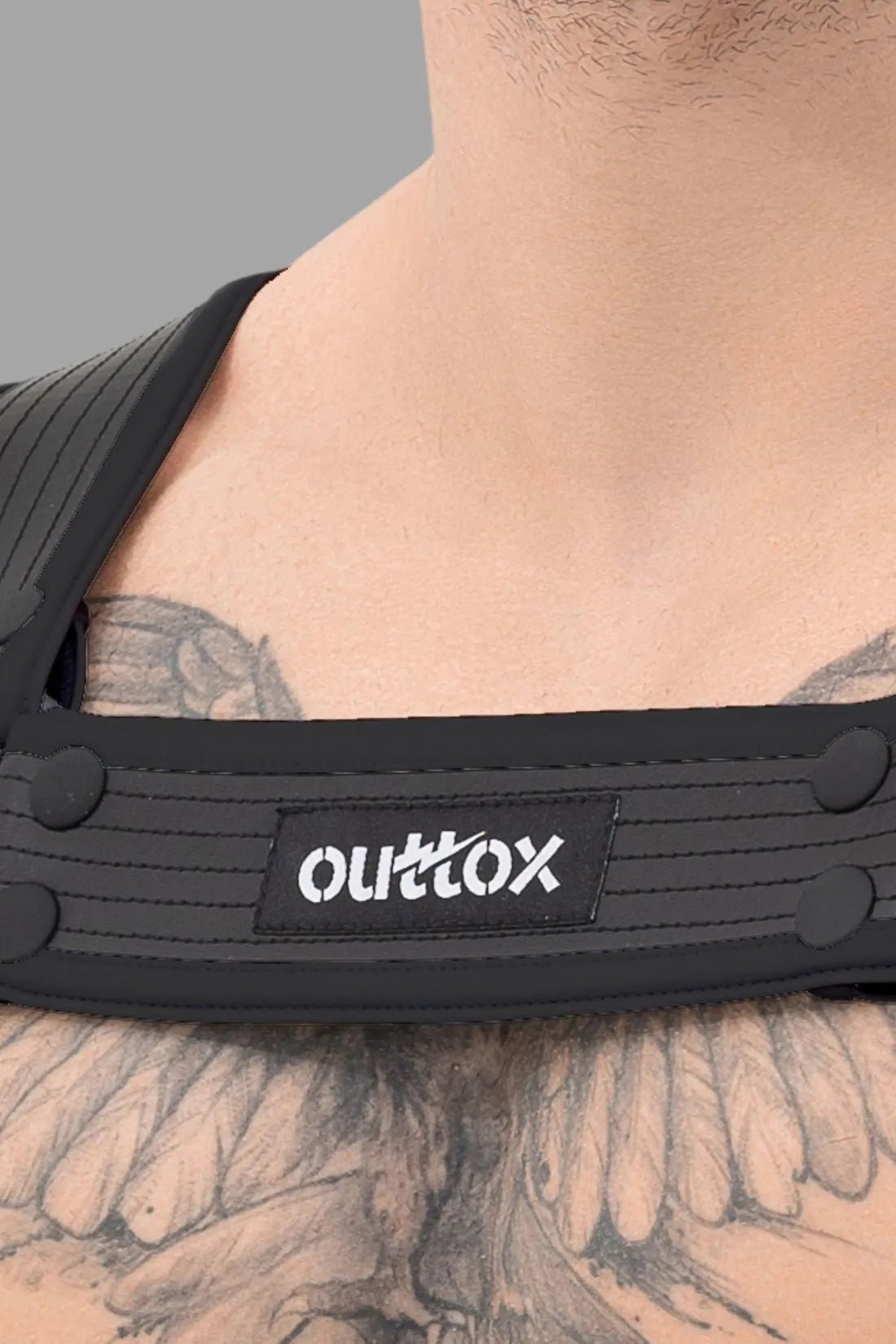 Outtox Body Harness with Snaps in black by Maskulo. A sleek accessory (XHR118) for men, with a secure fit and durable design.