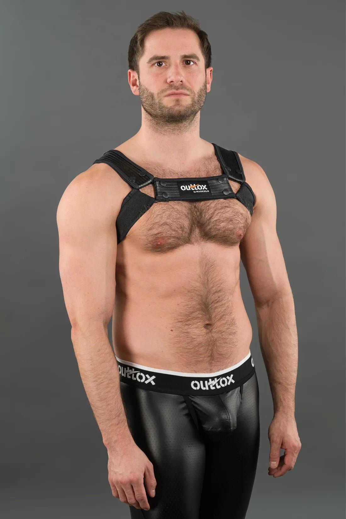 Outtox by Maskulo black bulldog harness with snaps. A leather-look harness accessory for adults, available in XXL.