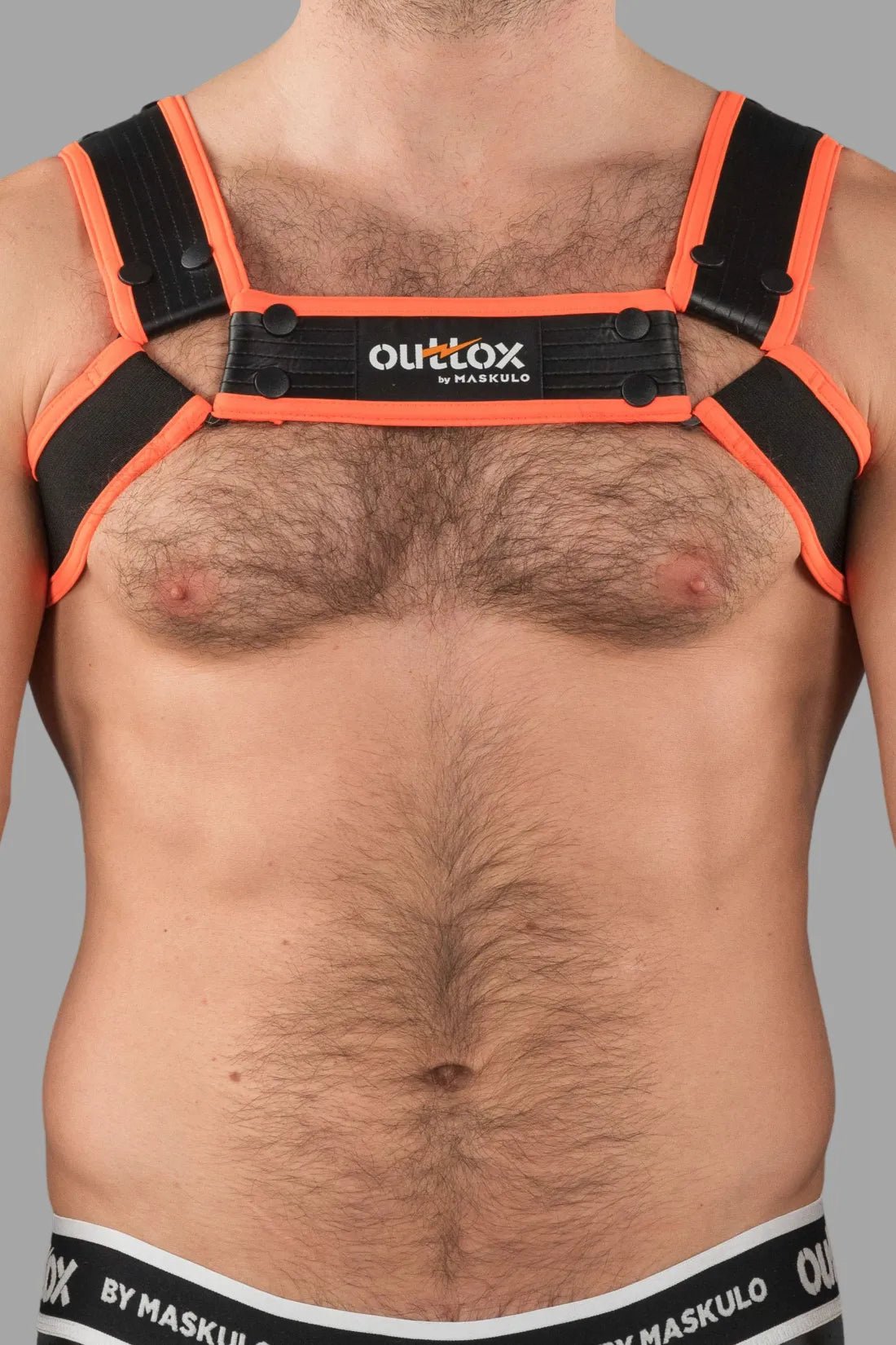 Outtox by Maskulo Black and Orange Bulldog Harness with Snaps. Adjustable, fetish-look, polyester/polyurethane/elastane blend.