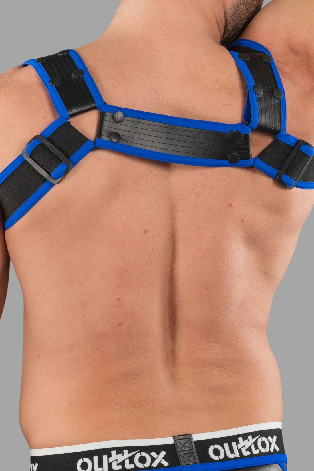 Outtox by Maskulo Body Harness with Snaps in Black and Blue, size XXL. Durable accessory with bold design and metal details.
