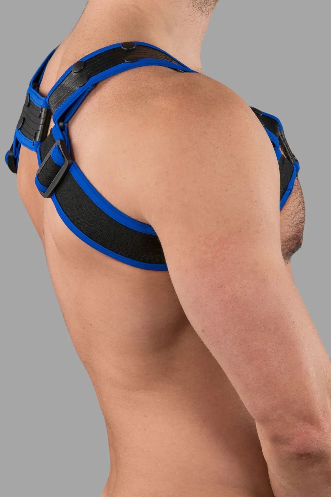 Outtox by Maskulo body harness with snaps in black and blue, a bold accessory from the Maskulo Global online store.