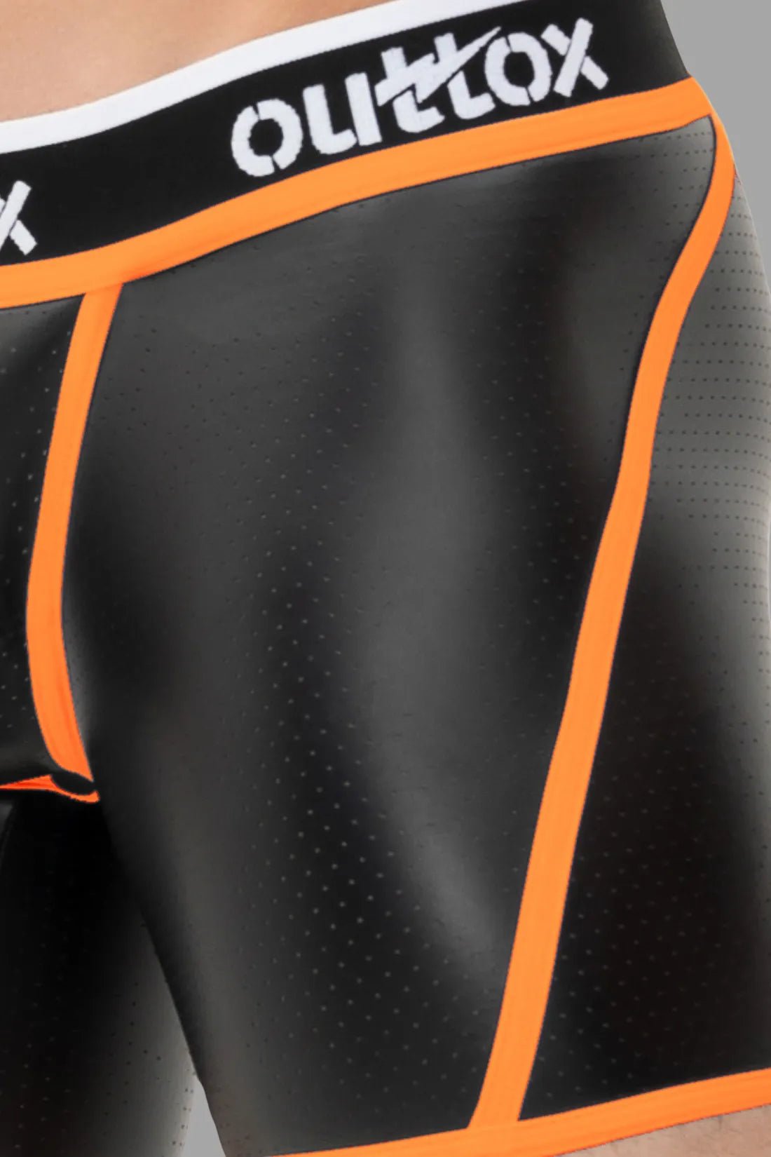 Outtox Open Rear Shorts in black &amp; neon orange: perforated PU eco leather material, snap codpiece, open rear, logo waistband. Bold style.