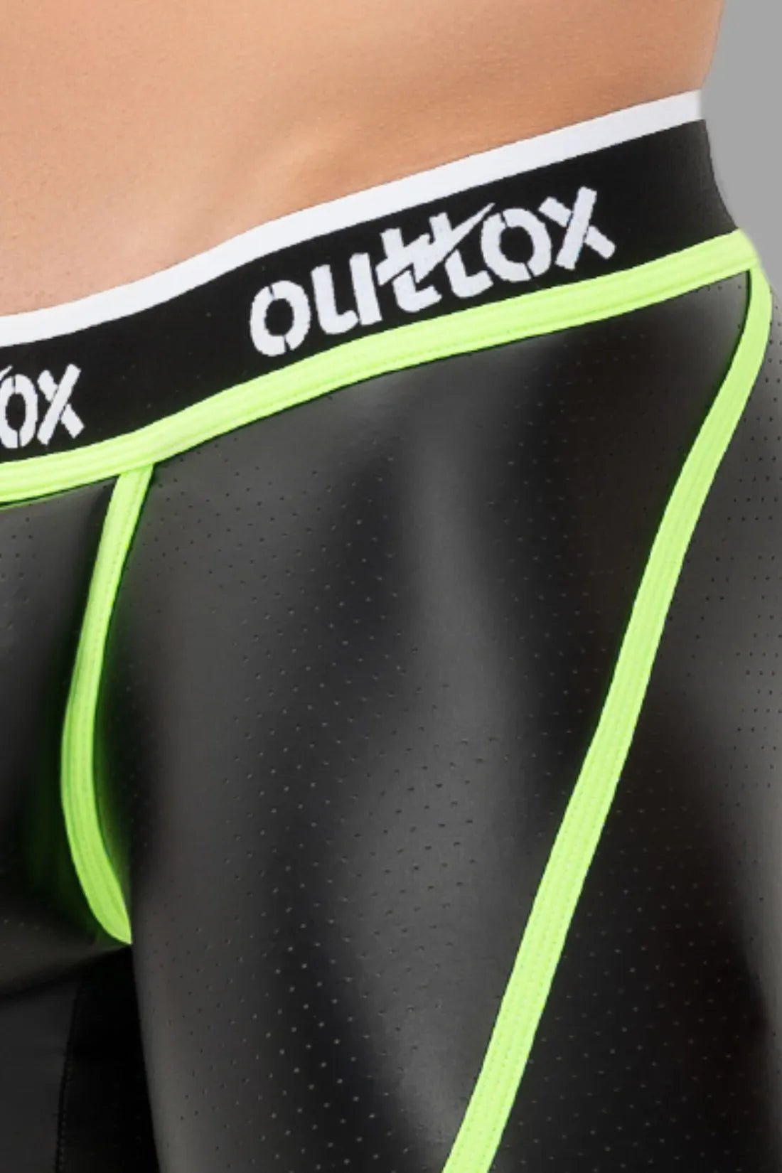 Outtox open rear shorts for men with snap codpiece in black and neon green. Maskulo Global (EU) store item.