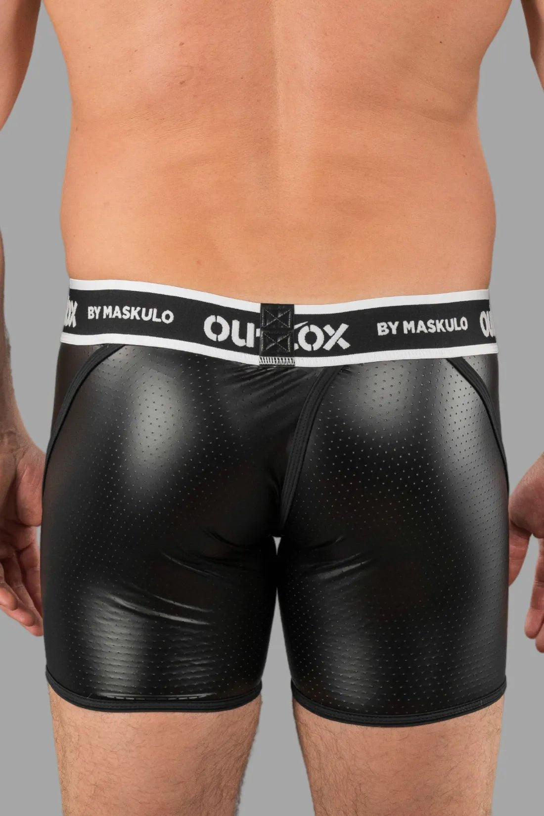 Outtox by Maskulo black shorts with snap codpiece and wrapped rear. Polyester, PU eco leather, and elastane blend for comfort and style.