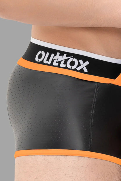 Outtox black and orange open rear trunk shorts with snap codpiece in perforated PU eco leather blend, available at Maskulo Global.